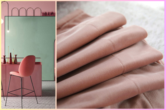 Modern blush pink blackout curtains folded and displayed in a stylish contemporary room.