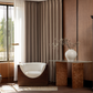 Deep walnut blackout curtains in a modern living room with accent chair and glass table