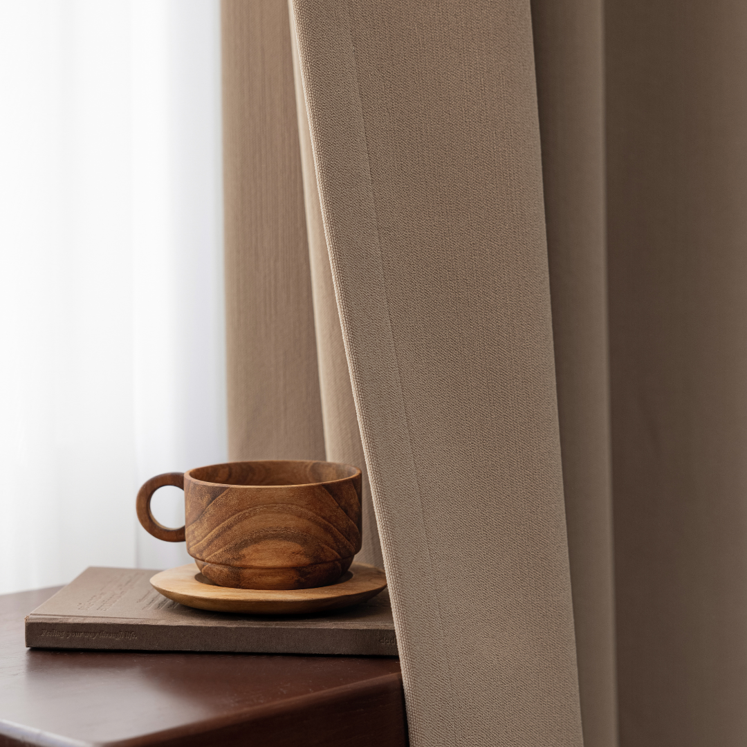 Deep walnut brown curtain with natural texture, wooden cup on table, soft daylight background