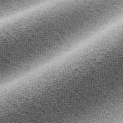 Close-up of grey textured curtain fabric, showing soft woven material